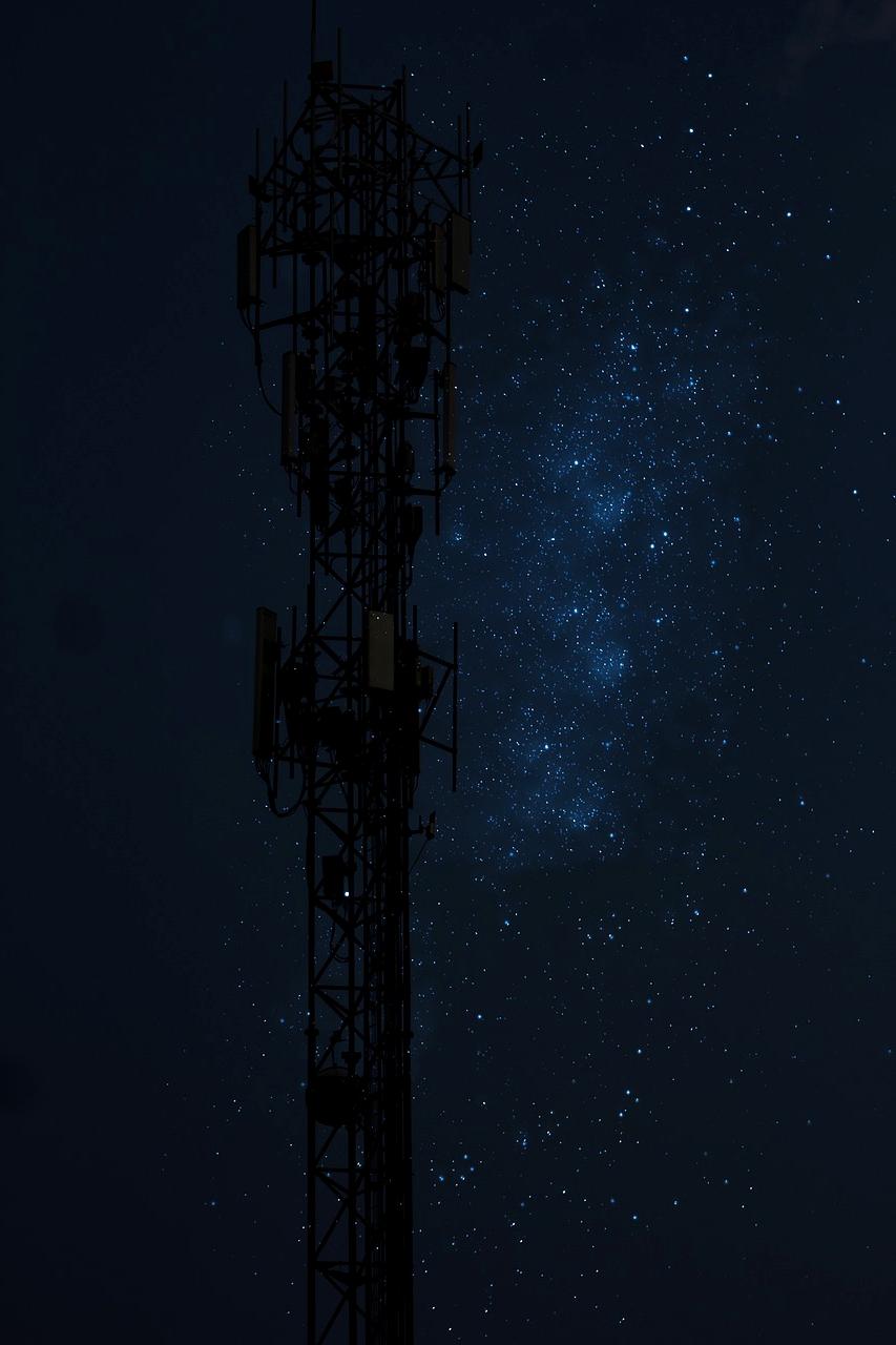 Network cables and wireless signals overlapping digital world map