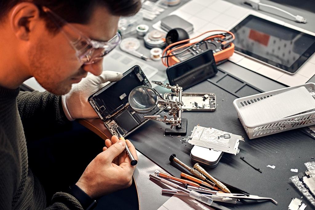 Technician configuring advanced wireless network hardware